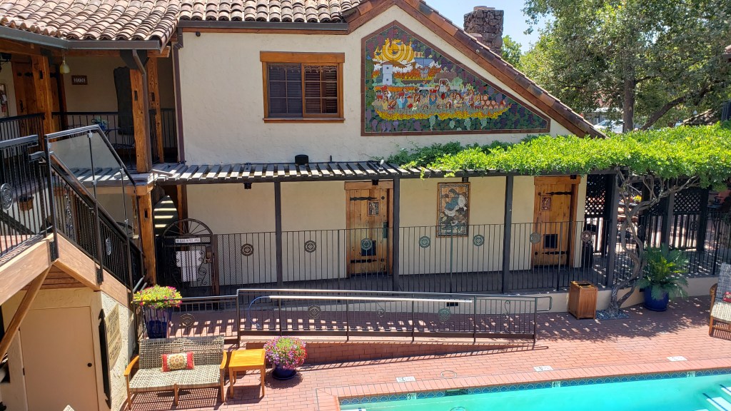 Courtyard pool and vine-covered walkway