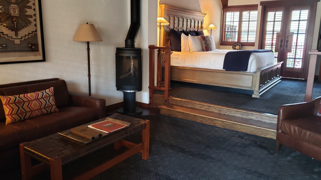 Two-level guest room with living room and raised bedroom