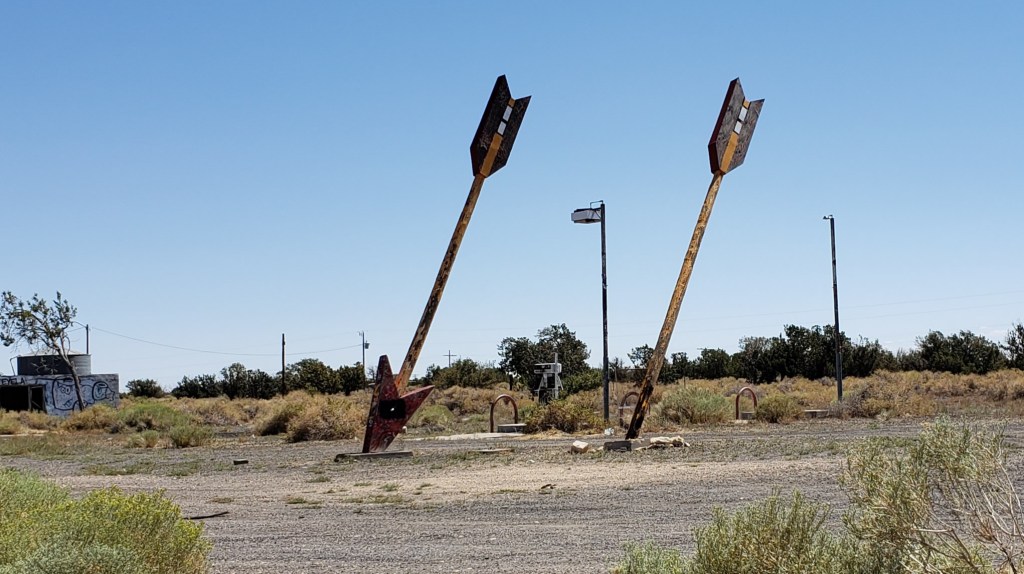 two giant arrows in dirt