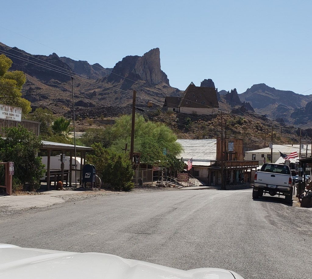 scene of road and buildings ahead as you enter town