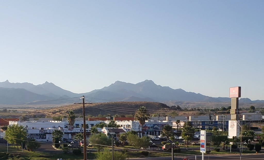 mountains in distance with buildings in foreground